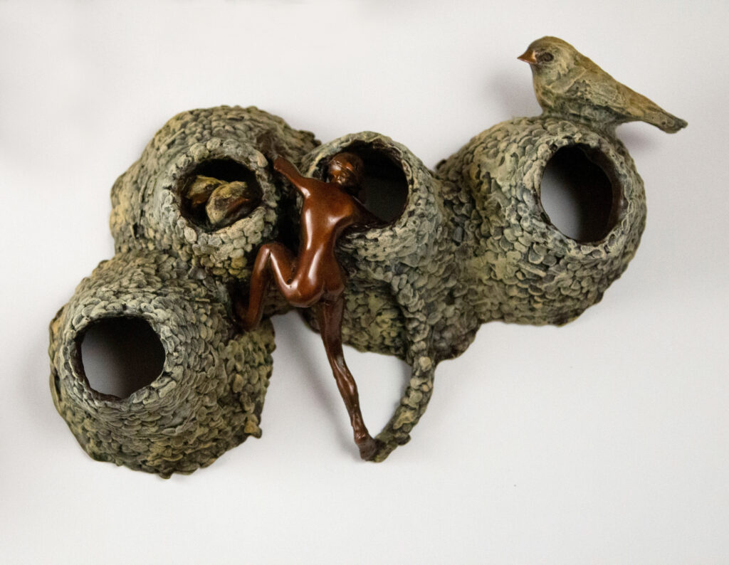 Bronze sculpture by Alicia Jones. This sculpture depicts a swallow colony with human invaders.